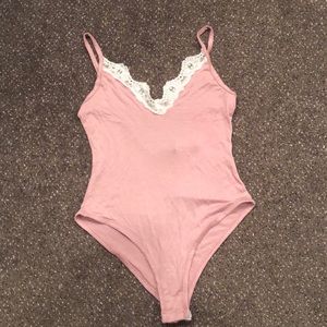 pink bodysuit with lace neckline